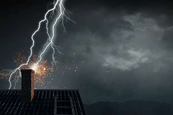 Lightning strike damage to a residential roof during a storm